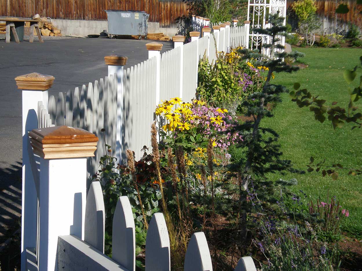 Garden with a white wooden fence