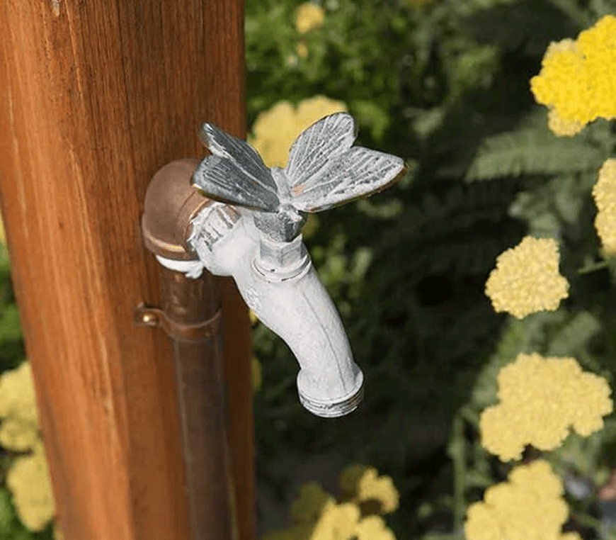 Vintage-style tap in garden setting